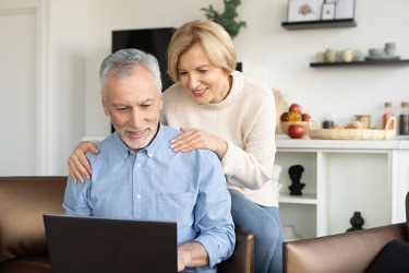 mature couple looking at laptop